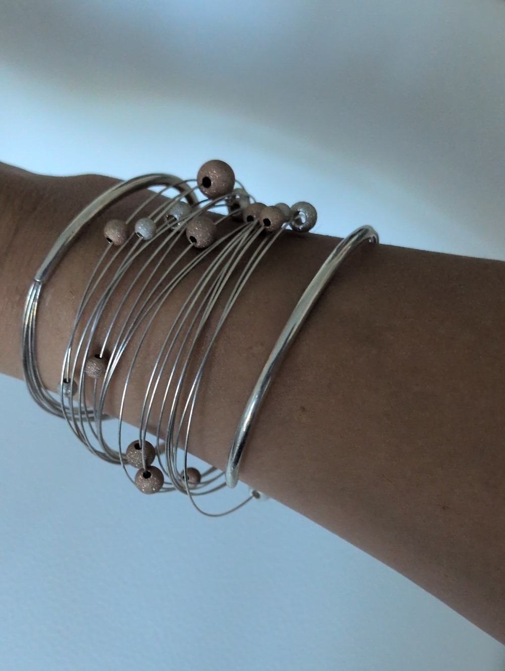Silver Multi-Wire Bangle Bracelet with Rose Gold Accent Beads